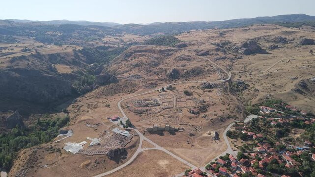 4K 10-bit drone shot flying forward and slowly descending over the ancient ruins of Hattusha, the lost Hittite capital in Turkey