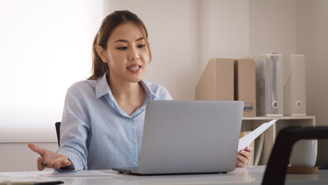 Bad Gen Z boss video call work argue point face stress yelling anger hate speech. Asia people woman fight on laptop videocall upset mad bossy. Online job issue mental health illness burnout at office.