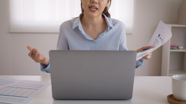 Bad Gen Z boss video call work argue point face stress yelling anger hate speech. Asia people woman fight on laptop videocall upset mad bossy. Online job issue mental health illness burnout at office.