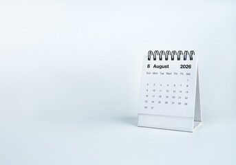 Desk calendar displaying August 2026 on white background with copy space. Scheduling, planning, time management, deadlines, business organization, appointments, productivity, annual planning concepts. © tete_escape