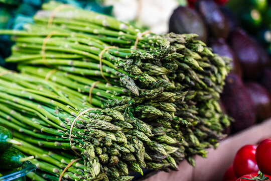 Fresh green asparagus bundles at the market