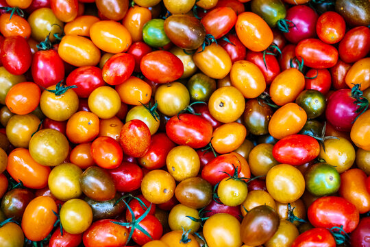 Assortment of multi-colored cherry tomatoes background 