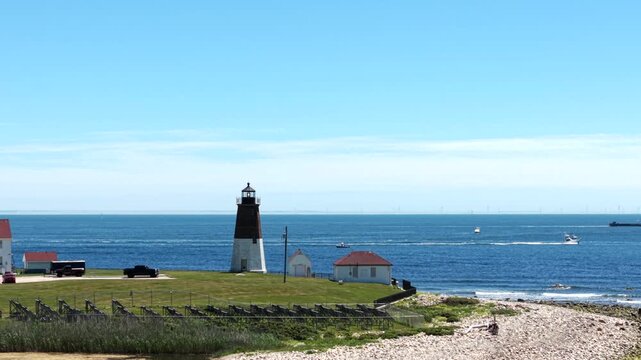 Point Judith Lighthouse With U.S. Coast Guard Station In Narragansett, Rhode Island, United States. Aerial Sideways Shot