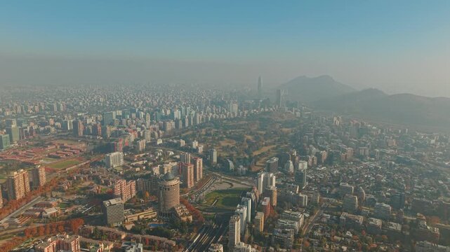 Aerial Panorama of Santiago Chile Skyline with Andes Mountains, Araucano Park and Financial District