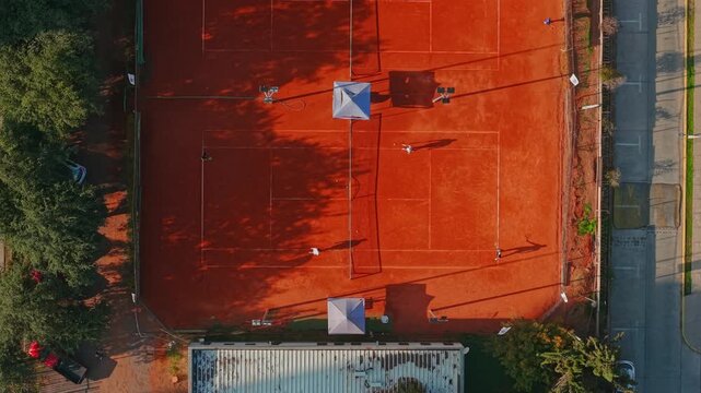 Multiple Clay Tennis Courts with Shadows at Araucano Park in Santiago de Chile Top Down Aerial View