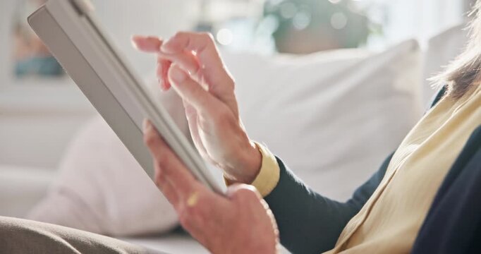 Hands, woman and relax in home with tablet, social media and browsing website for streaming. Scroll, rest and senior person with digital, download ebook and multimedia for movies subscription on sofa