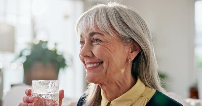 Senior, woman or drinking water in living room with glass, wellness and natural detox for gut health. Thirsty, old person and liquid beverage in home with hydration, nutrients and digestion benefits.