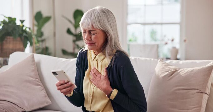 Chest pain, home and senior woman with phone, uncomfortable and communication with emergency service. Healthcare, request and elderly person with heart attack, typing and message on mobile in house