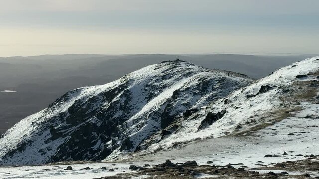 Mountains of Lake District cumbria national park in winter with snow. Recreation walking and climbing holiday UK England 4K