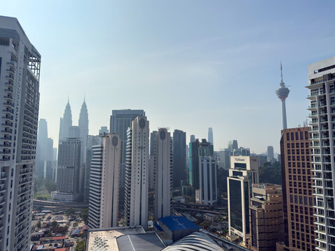 Kuala Lumpur, Malaysia - April 13, 2026: Petronas Twin Towers and KL Tower Skyline Seen from Rooftop