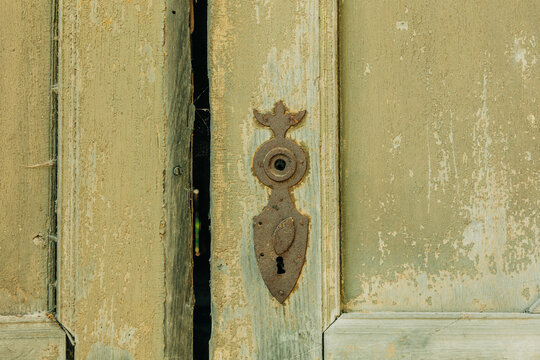 Wooden door with keyhole, ruins of 19th century building, Poland, Europe, summer.