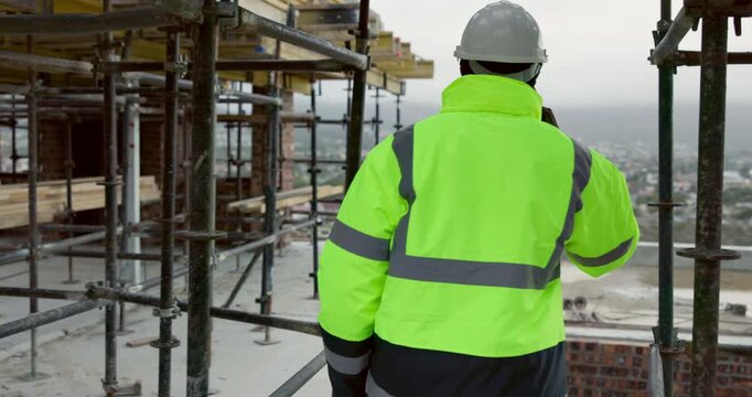 Man, architect and phone call at scaffolding for planning, compliance update and renovation. Engineer, back of person and tech on construction site for project feedback, talk and explaining extension