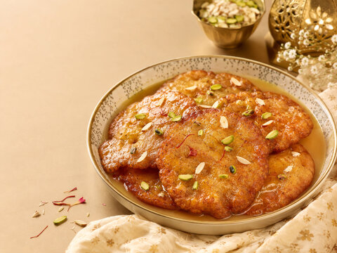 Malpua Indian Dessert with Syrup Dry Fruits and Saffron