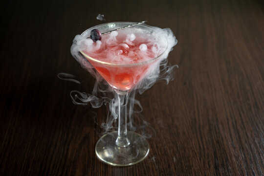 Red Cocktail with Dry Ice and Berries