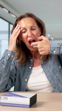 Woman At Home Looking Worried