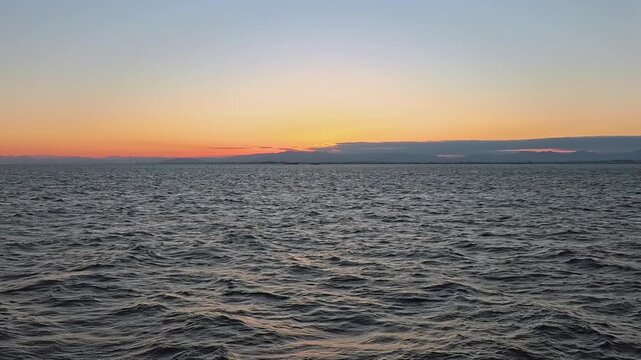Beautiful afterglow gradient sky over the deep ocean surface after sunset