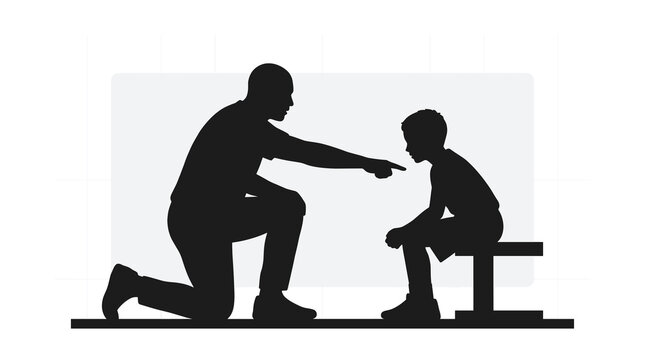 Silhouette of man disciplining or coaching a young boy on a bench