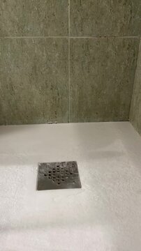 Shower Water Falling on Drain in Slow Motion