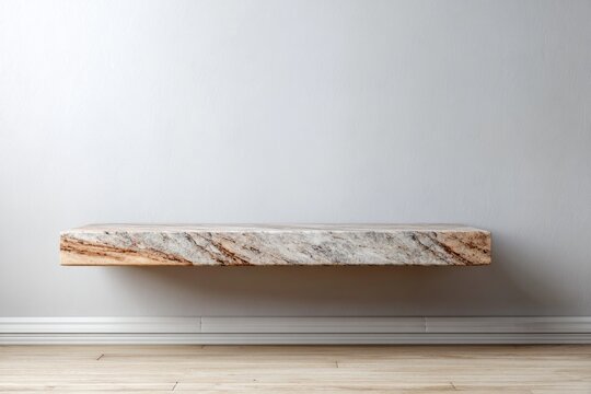 Floating granite shelf against a light wall in a room.