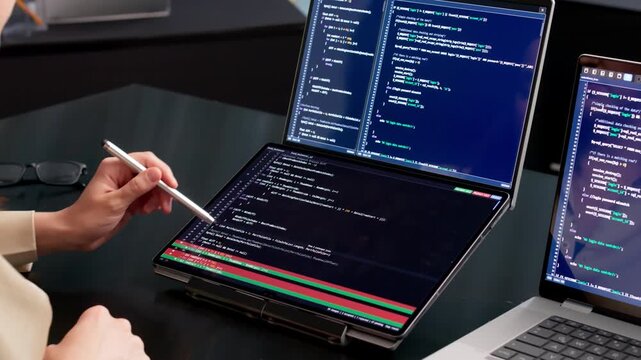 Software Developer Reviews Code Differences