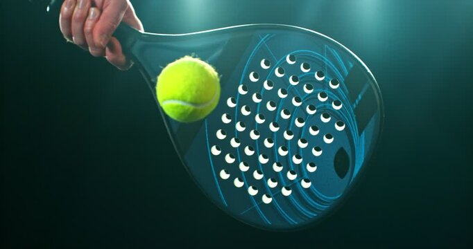 Super slow motion close-up of a hand holding a padel racket as a yellow ball hits the surface, filmed at 1000 fps. Dramatic studio lighting highlights the impact, motion of the racket and ball.