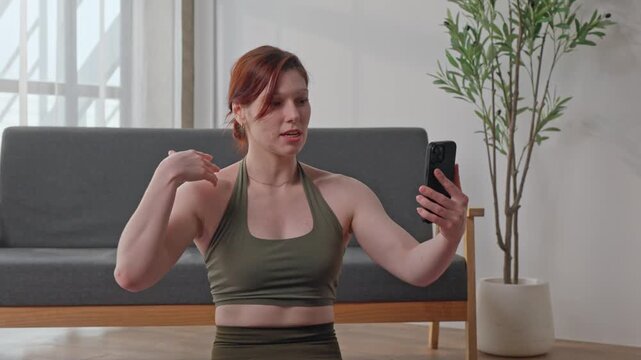 Fitness influencer live streaming workout session from home