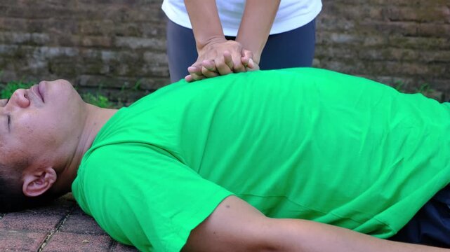 CPR training with hands press on patients chest, compressions for emergency resuscitation and rescue of man. Emergency technique for lifesaving, first aid and help in accident