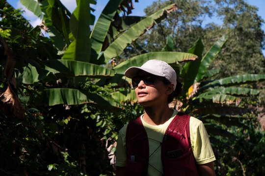 Woman with hydration vest enjoys a jungle hike