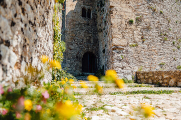 Naklejka premium Flower lined pathway leading to Castello di Venere in Erice, Sicily