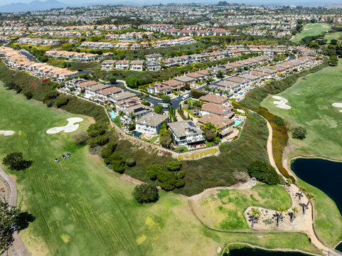 Luxe suburban homes bordering a green golf course