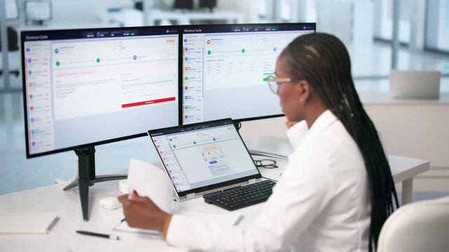 Medical Billing Specialist Reviews Patient Claims On Laptop