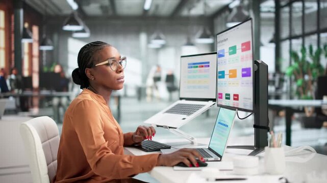 Woman Carefully Editing Growth Engine Blueprint
