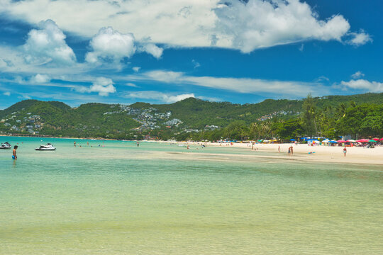 
KOH SAMUI, THAILAND - June 23,2026: Beautiful beach. View of nice tropical beach with white sand ,blue sea and blue sky. Holiday and vacation concept. Tropical beach Chaweng Noi beach, Samui. This wa