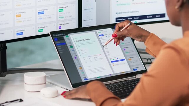 Project Manager Organizing Digital Files On Tablet