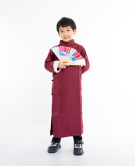 Fototapeta premium Smiling cute Asian boy in traditional Chinese clothing