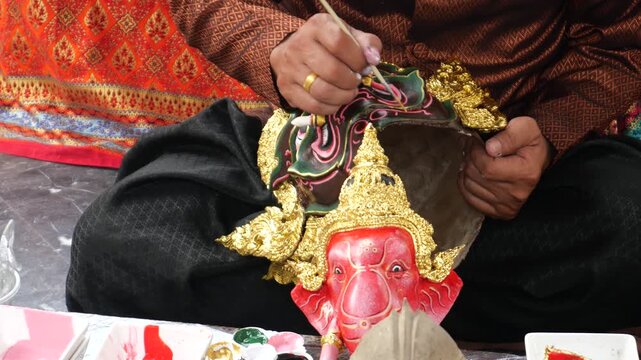 Craft of painting Khon characters, Thailand