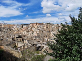 Fototapeta premium The Sassi di Matera is an ancient complex of cave dwellings carved into the limestone cliffs of a deep canyon in the Basilicata region of southern Italy. It is one of the oldest continuously inhabited
