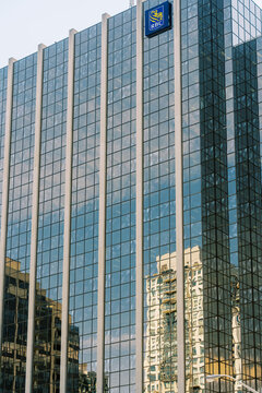 Toronto, Canada - May 26, 2026: Modern glass office building with RBC logo and city reflections