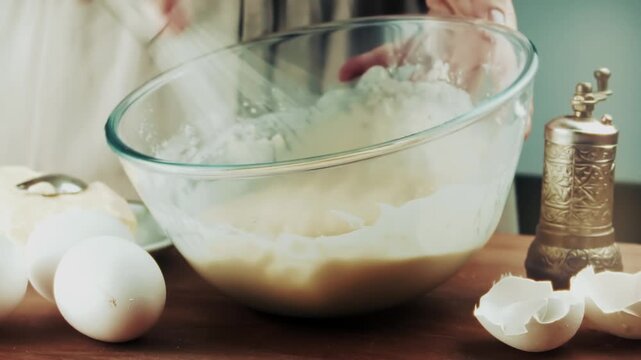 Whisking Liquid Dough Batter In Glass Bowl With Hand Whisk Tool. Preparing Homemade Dessert
