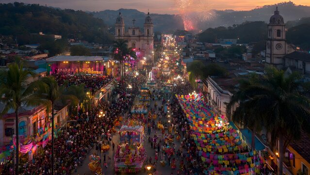 Aerial view of people celebrating a religious street carnival at night
