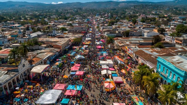 Aerial view of a crowded street festival during the Santa Tecla celebration
