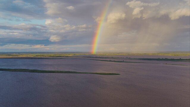 Aerial view of a rainbow over Mobile Bay