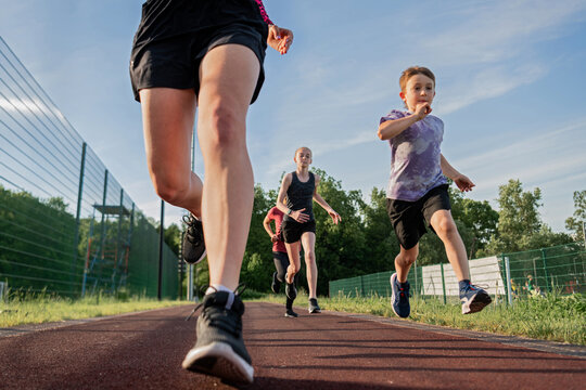 Young runners training together on a sunny day