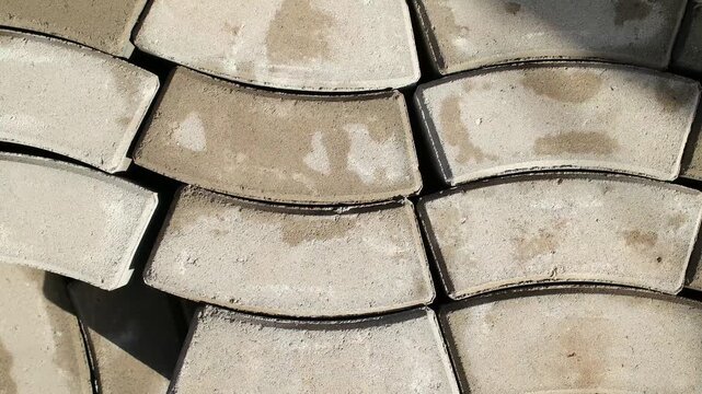 Close Up of Stacked Gray Paving Stones at Building Supply Store. Detailed close-up of gray paving stones stacked in rows at a construction materials store.