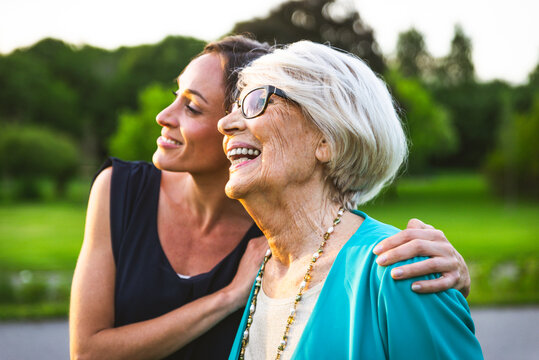 Smiling women looking away at park