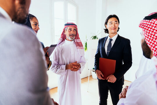 International businessman smiling during corporate office meeting