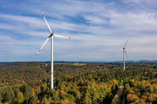 Germany, Baden-Wurttemberg, Aerial view of wind farm surrounded by autumn forest