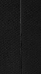 Fototapeta premium Black textured mobile wallpaper with a subtle vertical seam design.