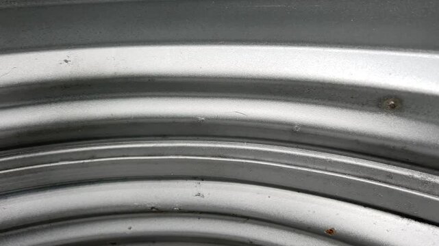 Curved Metal Window Well with Pebbles