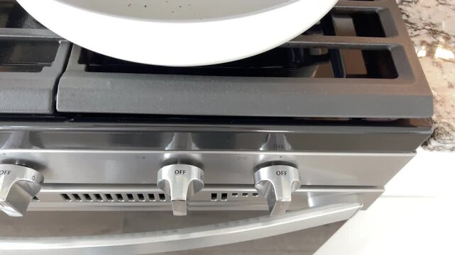 Closeup of frying pan on gas stove burner